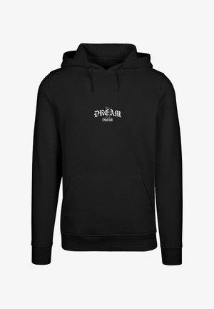 Must mustaga, millel on esikoti, millel on valge trükitud disain, mis ütleb "Teie UNISTUS" ja "UNISTUS" stiilsetes kirjas. Pehme kangatextuur.