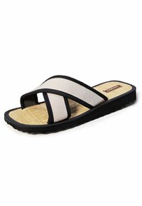 Black and beige flip-flop sandal with crossed fabric straps, textured sole, and a natural fiber footbed. Durable rubber outsole with grip.