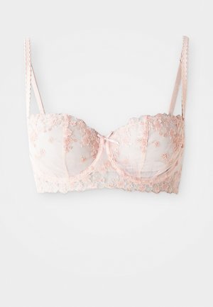 Soutien-gorge balconnet en dentelle rose avec broderie florale, bretelles ajustables et un détail de nœud central, conçu avec des bonnets en mesh transparent.