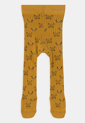 Gelbe gerippte Strumpfhosen mit einem Muster aus schwarzen Katzen mit blauen Augen und Blumen. Hoher Taillenbund mit aufgedrucktem Markennamen.
