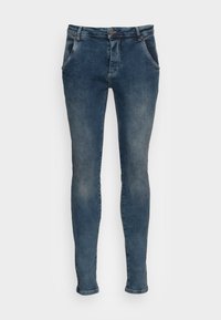 Jeans ajustados de denim en un tono azul desgastado. Cuentan con cinco bolsillos, presillas para cinturón y un cierre de cremallera con botón.