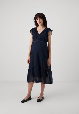 Vestido azul marino con escote en V, mangas con volantes y dobladillo en capas. Fabricado con un tejido ligero, adecuado para diferentes tipos de cuerpo.
