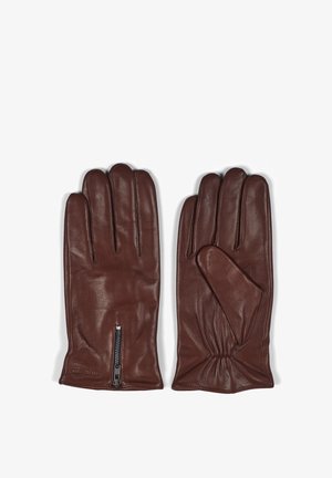 Guantes de cuero marrón con una textura suave, que cuentan con tres dedos y un detalle de cremallera lateral para un fácil uso. Fabricados con un material blando y flexible.