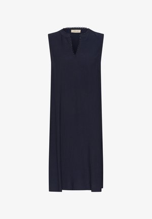 Ermeløs marineblå kjole med V-hals og bølget kant. Lett, teksturert stoff med en avslappet passform som faller rett over kneet.