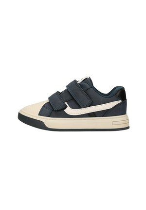Basket basse enfant en bleu marine et beige avec deux bandes velcro et une bande latérale blanche.