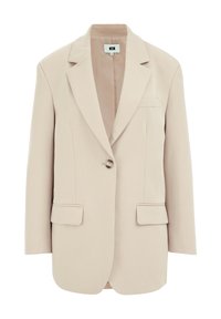 Beige skräddarsydd kavaj med en enda knapp, slagkragar, två framfickor och ett slätt, lätt tyg. Inredning fodrad i kontrasterande färg.