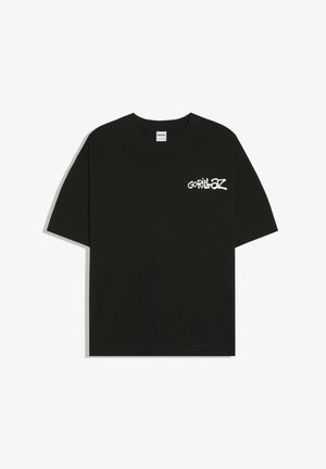 T-shirt noir à manches courtes avec logo texte blanc « Gorillaz » sur la poitrine gauche et col rond.
