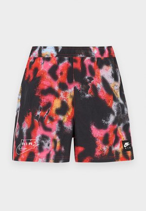 Pantalones cortos negros con un patrón abstracto multicolor en rojo, rosa y azul, con un logo blanco de Nike Air y acentos laterales en contraste.