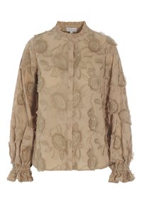 Beige embroidered blouse with flower patterns, button front, ruffled collar, and elasticized cuffs. Soft, textured fabric with details.