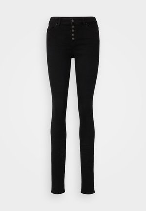 Calças skinny de cintura alta pretas em denim, com cinco botões à frente, passantes para cinto e uma textura suave.