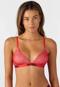Red mesh bralette with a V-neck design, adjustable straps, and a branded black waistband featuring a subtle pattern throughout.