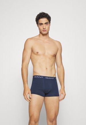 Marineblaue Boxershorts aus Baumwolle mit weicher Textur, ausgestattet mit einem markierten Bund, auf dem in kontrastierendem Weiß "GANT" steht.