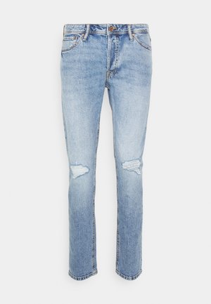 Light blue denim jeans with a straight cut, featuring two knee rips, copper hardware, and classic five-pocket design.