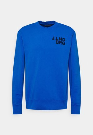 Blaues Sweatshirt mit langem Arm und Rundhalsausschnitt mit schwarzem Schriftzug „J.LND BRG“ auf der linken oberen Brustseite.