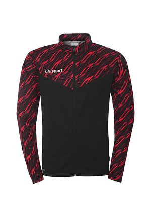 Schwarze Jacke mit einem rot-schwarzen Zickzackmuster. Sie hat einen hohen Kragen und einen vollständigen Reißverschluss. Das "uhlsport"-Logo befindet sich auf der Brust.