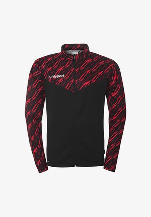 Zwarte jas met een rood en zwart zigzagpatroon bovenaan. Heeft een hoge kraag en een volledige rits. "uhlsport" logo op de borst.