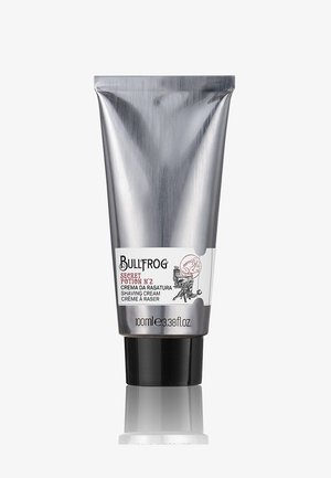 Rasierschaumtube Bullfrog Secret Potion Nr. 2 mit silbernem Körper, schwarzem Deckel und 100-ml-Etikett, das Logo und Produktdetails zeigt.