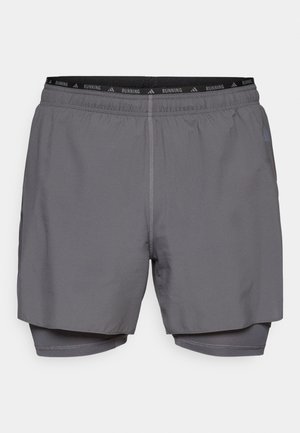 Gray running shorts with an elastic waistband, inner lining, and contrasting stitching. Features a logo detail at the waistband.