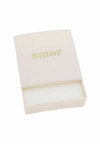 Cremfarbener Kasten mit glatter Oberfläche, auf dem Deckel befindet sich das Wort "amor" in goldener Schrift; leerer Innenraum mit subtiler Textur.