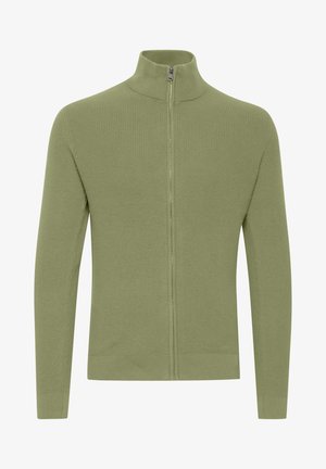 Green ribbed zip-up sweater with a stand collar, long sleeves, and a smooth texture, featuring a central zipper and fitted hem.