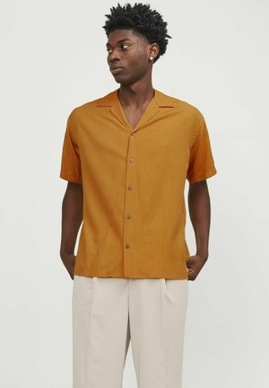 Short-sleeve, button-up shirt in mustard yellow, featuring a notch collar, subtle vertical stripes, and brown buttons. Smooth fabric texture.