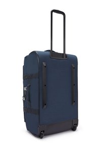 Navy wheeled duffel bag with a retractable handle, durable fabric, side handles, and black plastic accents. Smooth-rolling wheels.