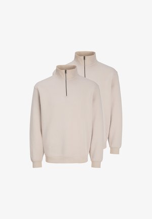 Dwie beżowe bluzy z długim rękawem, z kołnierzem na ćwierć suwaka, ściągaczami na mankietach i dolnych krawędziach, prezentowane na białym tle.