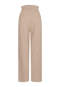 Pantalons larges de couleur beige clair en tissu texturé. Dotés d'une taille élastique avec un haut froncé.