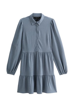 Blue long-sleeve shirt dress with a button-down front, collar, and tiered ruffled hem. Made from textured fabric, featuring a relaxed fit.