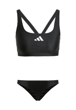 Black two-piece swimsuit featuring a sports bra top with crisscross straps and a bikini bottom with side ruching details. White logo accent.