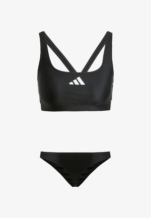 Black two-piece swimsuit featuring a sports bra top with crisscross straps and a bikini bottom with side ruching details. White logo accent.