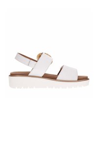 White leather sandal with two straps, a rounded toe, and a decorative button. Features a lightweight white sole with a textured bottom.