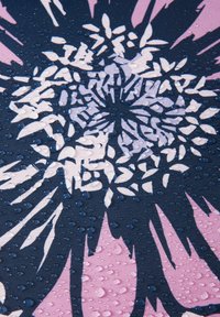 Textile with a floral design in pink and purple on a dark blue background, featuring a smooth texture with water droplets on the surface.