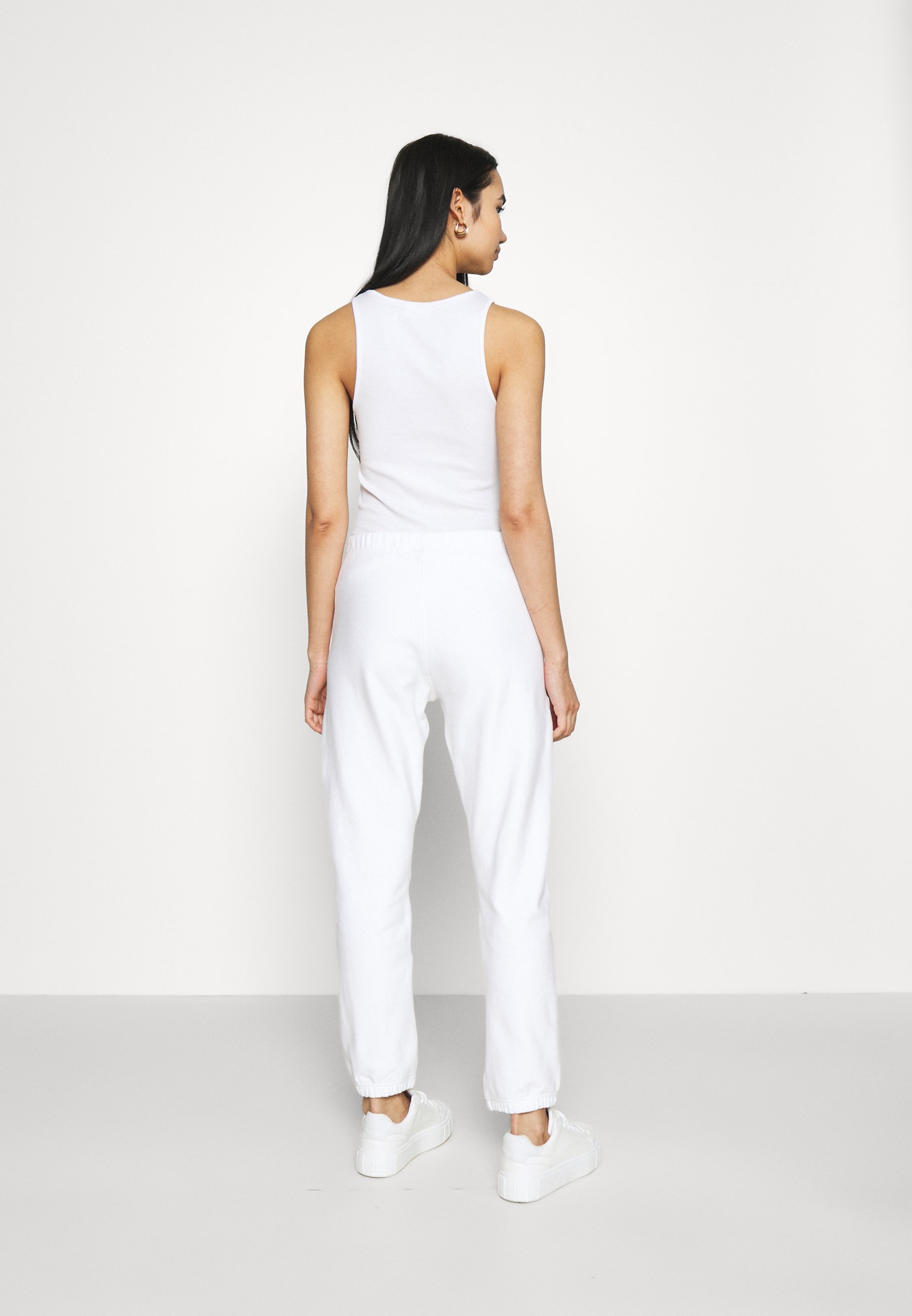 Champion Reverse Weave ELASTIC CUFF PANTS - Pantalones deportivos - white/ blanco - Zalando.es