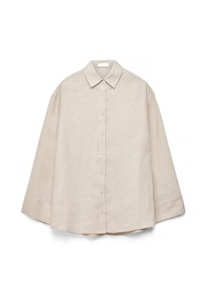 Beżowa koszula na długi rękaw z guzikami, z ostrym kołnierzykiem, widocznymi guzikami z przodu i luźnym krojem, pokazana na płasko na białym tle.