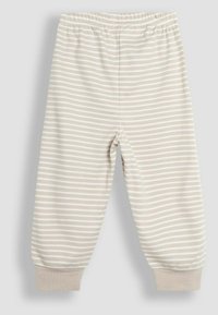 Lichtbeige gestreepte broeken met een elastische tailleband en geribbelde manchetten. De stof is zacht en heeft dunne witte strepen op een gladde textuur.