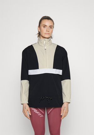 Πουκαμίσα ζακέτα σε μαύρο και μπεζ με μισό φερμουάρ, ελαστικούς αφανούς και λευκή ρίγα στη στήθος. Με κορδόνι στο πλάι για ρύθμιση.