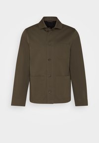 Giacca marrone a maniche lunghe con colletto, tasca frontale e due tasche inferiori. Realizzata in un tessuto liscio con un design strutturato.
