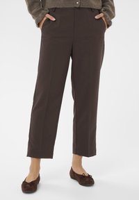 Brown tailored trousers with a straight-leg design, featuring side pockets and a clean finish. The fabric appears smooth and structured.