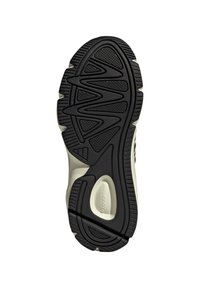 Schwarze Gummisohle mit strukturiertem Grip, ausgestattet mit wellenförmigen Profilmustern und einer glatten Zwischensohle. Neutrales Farbschema mit leichtem Glanz.