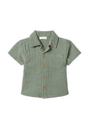 Chemise à manches courtes, boutonnière, en vert clair, fabriquée en coton texturé. Elle présente un col, une poche avant et des boutons en bois.