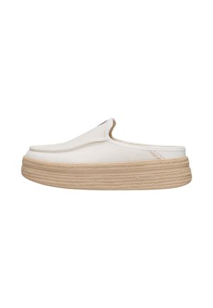 White slip-on mule shoe with textured fabric upper and thick beige rubber sole featuring braided pattern detail.