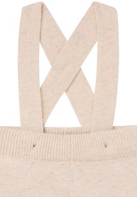 Beige gebreide bretels met een kruislings ontwerp. Heeft een geribbeld textuur en zachte stof, geschikt voor casual kleding.