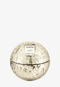 Kultavärinen pallomainen voidepurkki, jossa on teksturoitu pintakuviointi. Etiketissä lukee valkoisessa suorakulmiossa "BABOR HSR cream rich".