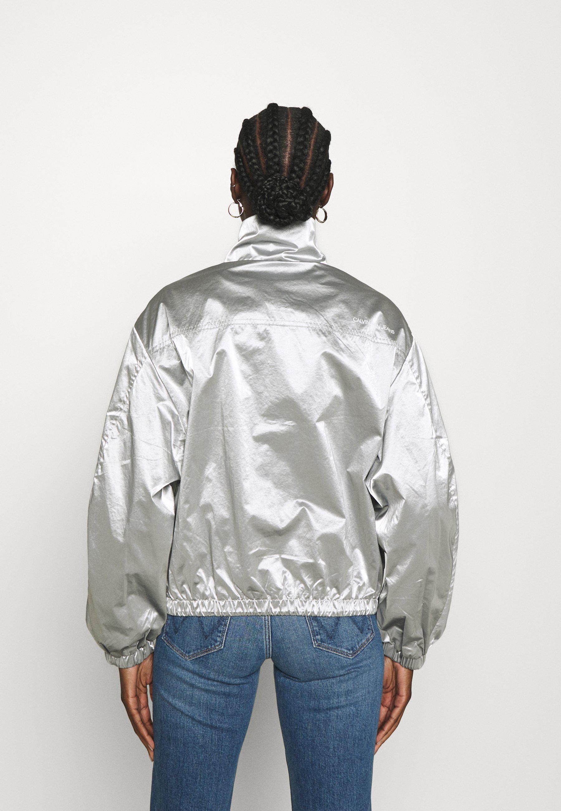 silver windbreaker