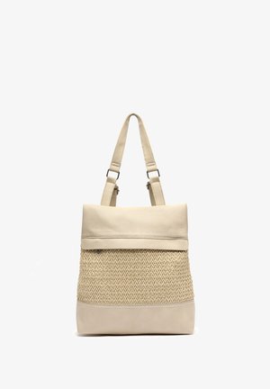 Beige tote bag with woven texture center panel, smooth leather top flap, base, and adjustable shoulder straps.