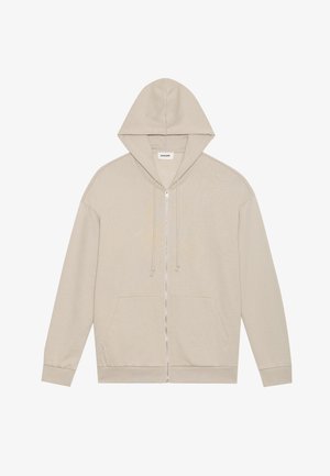 Sweatshirt bege com fecho, com capuz, bolsos frontais e cordões. Feito de um tecido suave com uma textura lisa e punhos canelados.