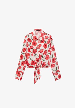 Red floral cropped shirt with a white background, featuring a collar, long sleeves, and a front tie detail. Made of smooth fabric.