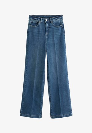 Wijdvallende jeans in donkerblauwe denim met een gemiddelde wassing. Heeft een vijf-pocket ontwerp, rits en knoopsluiting.