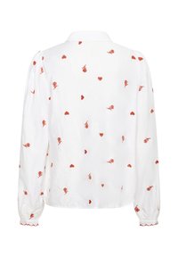 Witte blouse met rode geborduurde rozen en harten, met lange mouwen, een kraag en elastische manchetten met gegolfde rand.